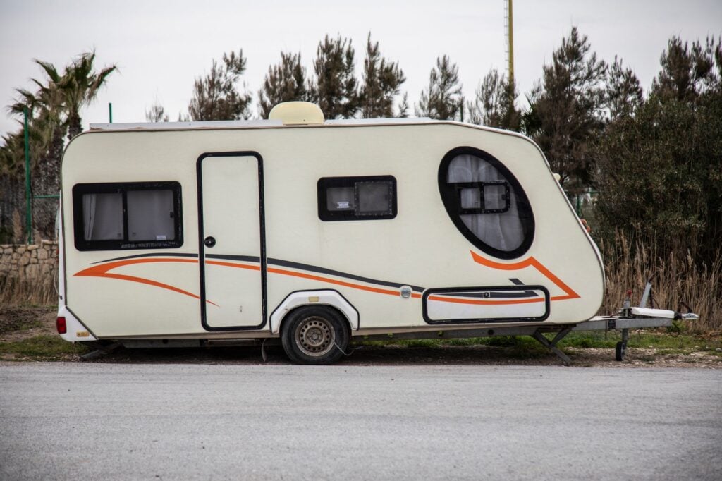 Your 2026 Guide to Finding Mobile RV Wash Near Me Service in Ocala 1 mobile rv wash near me technician hand-washing a travel trailer in an Ocala driveway