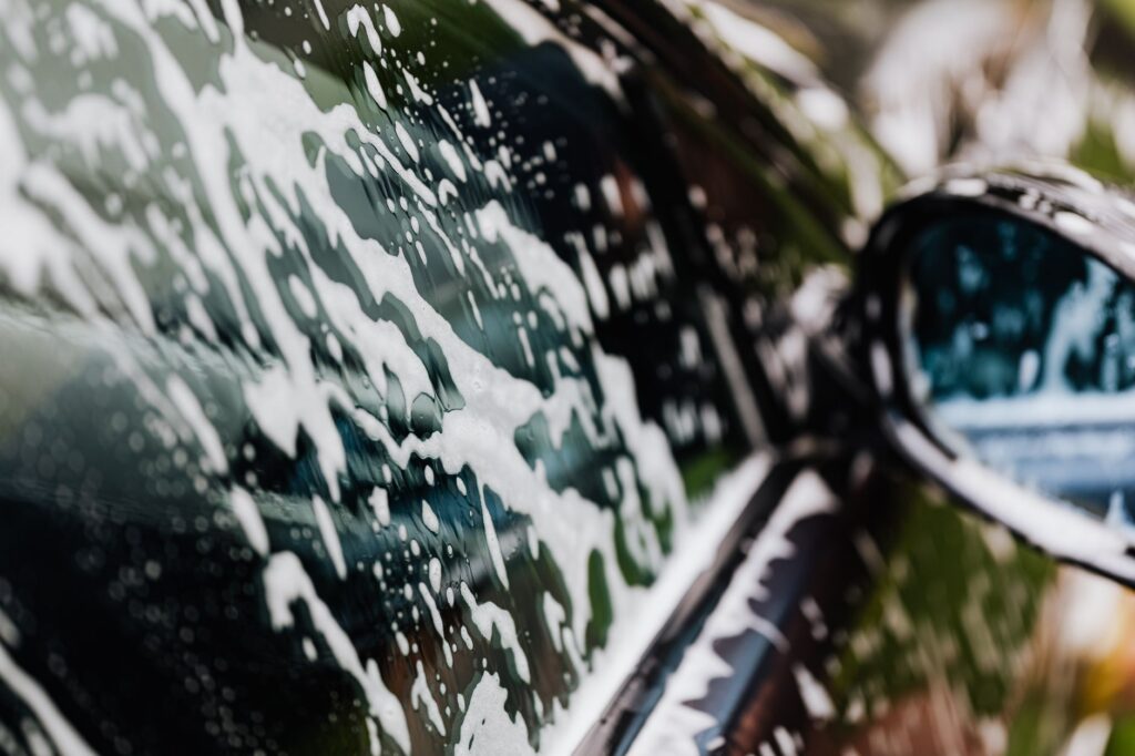 Ocala RV Owners: How to Choose a Motorhome Washing Service Near Me in 2026 1 mobile motorhome washing service near me technician rinsing an RV exterior in Ocala FL