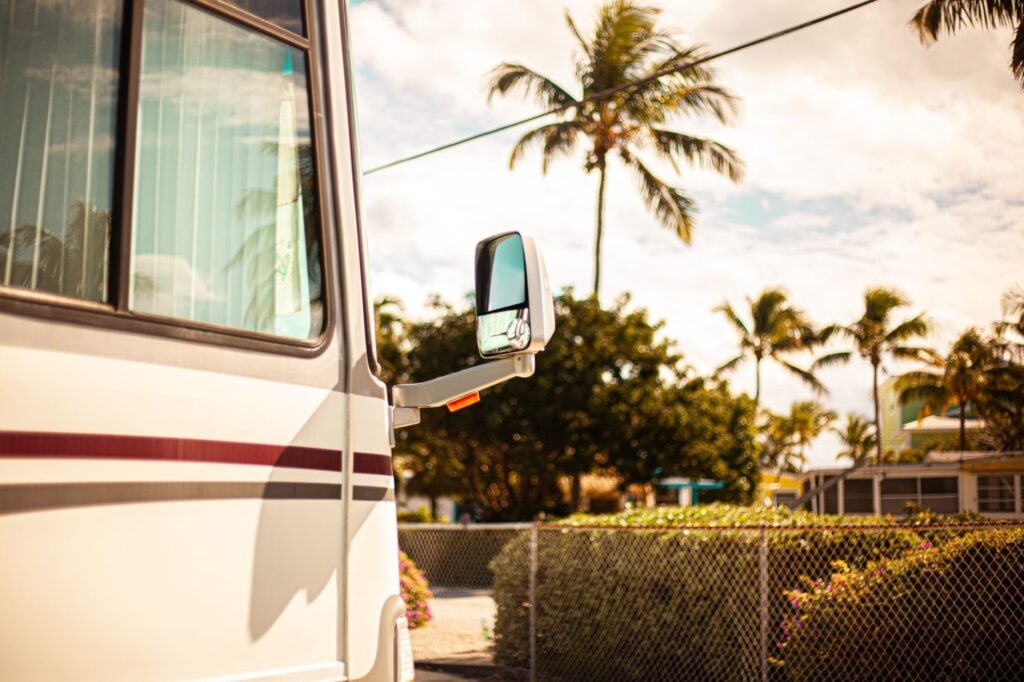 mobile technician performing rv detailing near me service on a motorhome exterior in Ocala driveway