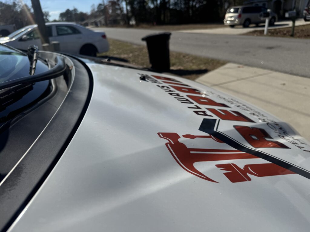 technician applying ceramic coating to a fleet truck hood in Ocala FL