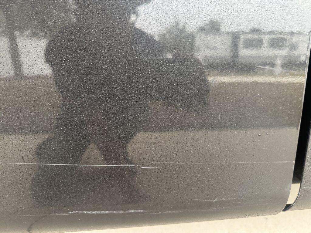 Finding Genuine Cilajet Ceramic Coating in Ocala, FL 2 water beading on a ceramic coated RV panel after rain in Ocala FL