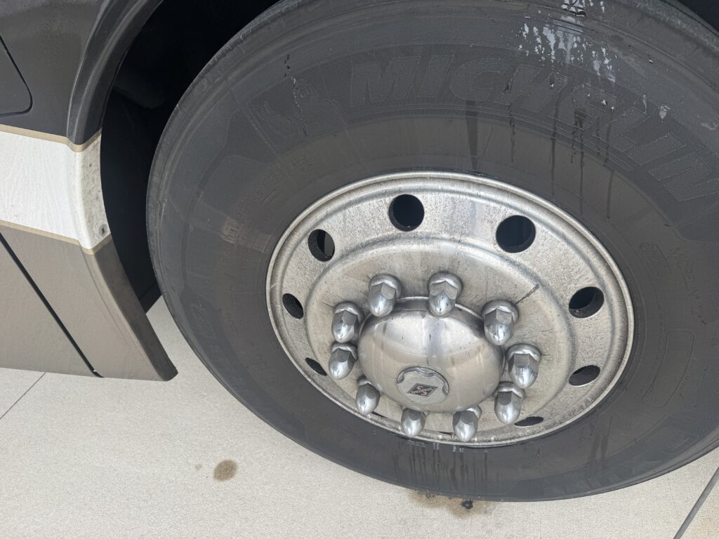 close-up of chrome polishing during a motorcycle wash service