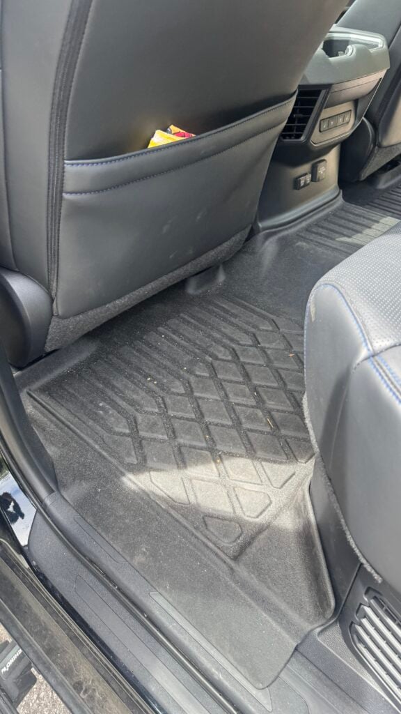 Heavy Equipment Detailing in Ocala: Protect Your Investment Year-Round 1 technician performing equipment detailing on a tractor undercarriage in Ocala